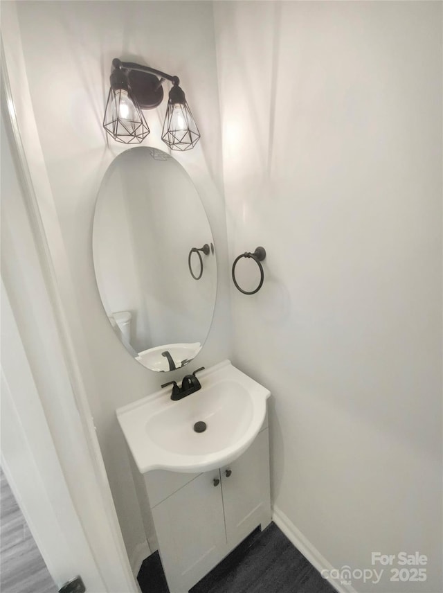 bathroom with baseboards and vanity