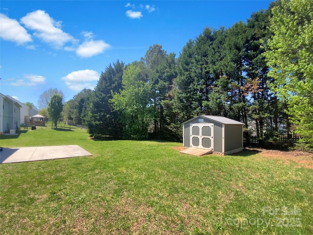 view of yard with a storage shed and an outbuilding