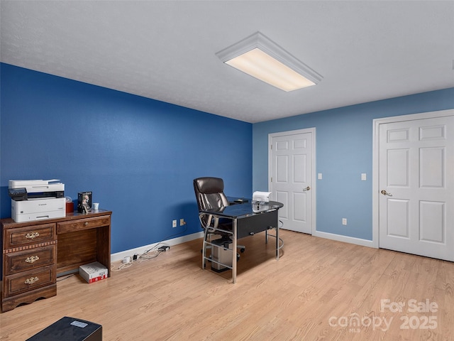 office area with wood finished floors and baseboards