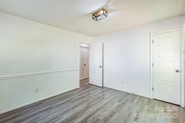 unfurnished bedroom with wood finished floors