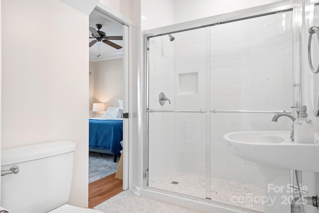 220 Chandeleur Dr, Mooresville, NC 28117 - ensuite bathroom featuring a shower stall, ceiling fan, toilet, and wood finished floors