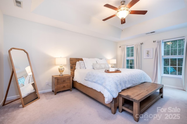 220 Chandeleur Dr, Mooresville, NC 28117 - carpeted bedroom featuring baseboards, a tray ceiling, and ceiling fan