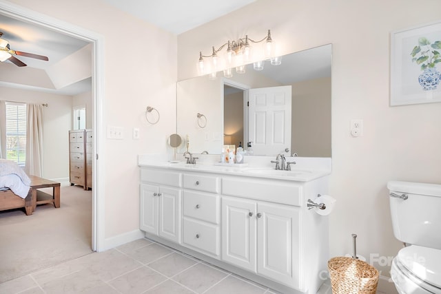 220 Chandeleur Dr, Mooresville, NC 28117 - bathroom featuring ceiling fan, toilet, ensuite bath, double vanity, and a tray ceiling