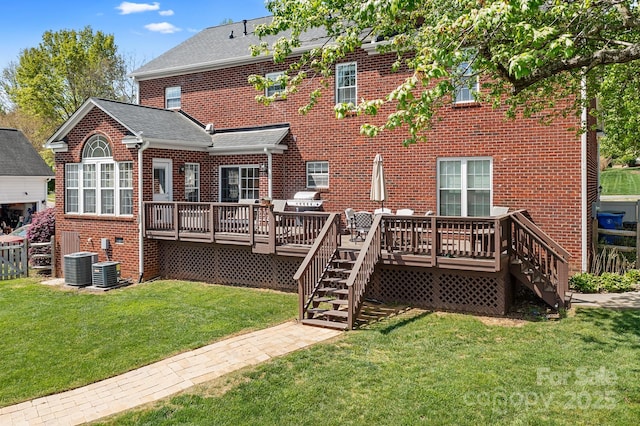 220 Chandeleur Dr, Mooresville, NC 28117 - back of property with stairway, brick siding, a deck, and a yard