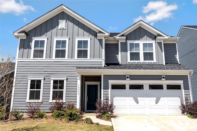 14224 Canemeadow Dr, Charlotte, NC 28278 - view of front facade with board and batten siding, concrete driveway, a garage, and a shingled roof