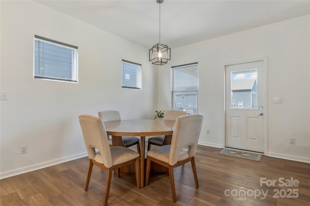 14224 Canemeadow Dr, Charlotte, NC 28278 - dining space featuring dark wood-style flooring and baseboards