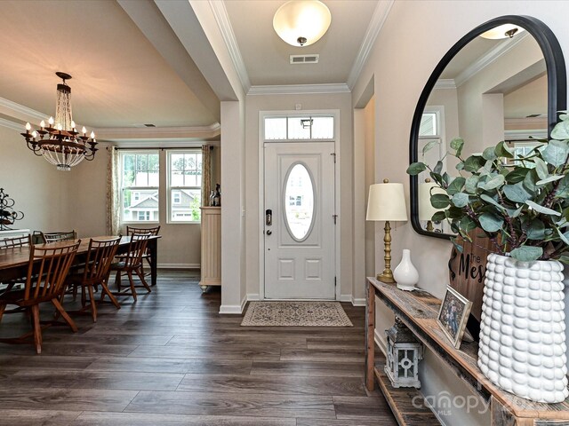 10035 Mast Cove Ln, Charlotte, NC 28278 - foyer with a chandelier, crown molding, dark wood-type flooring, and baseboards
