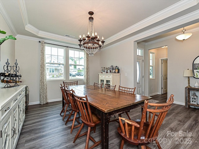 10035 Mast Cove Ln, Charlotte, NC 28278 - dining area with a chandelier, dark wood-type flooring, crown molding, and baseboards