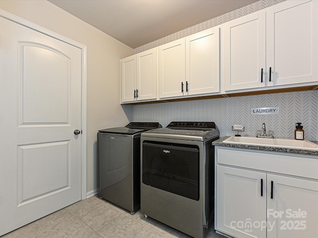 10035 Mast Cove Ln, Charlotte, NC 28278 - clothes washing area featuring washer and clothes dryer, cabinet space, and light tile patterned floors