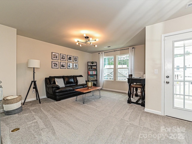 10035 Mast Cove Ln, Charlotte, NC 28278 - living room featuring carpet, baseboards, and a chandelier