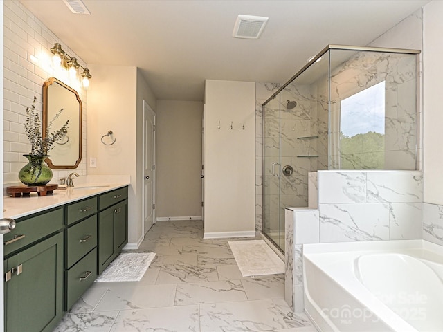 10035 Mast Cove Ln, Charlotte, NC 28278 - bathroom with marble look tile flooring, a garden tub, a shower stall, vanity, and baseboards