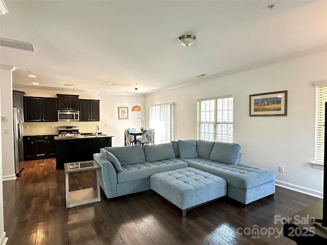 12421 Fiorentina St, Charlotte, NC 28277 - living area with crown molding, dark wood-style flooring, and visible vents