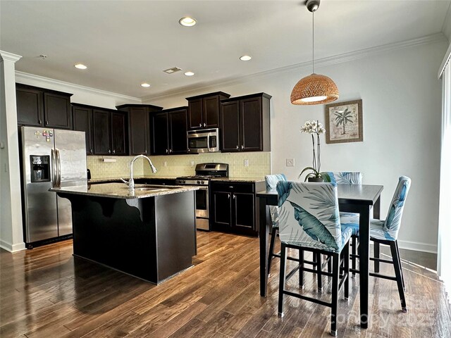 12421 Fiorentina St, Charlotte, NC 28277 - kitchen with light stone counters, backsplash, crown molding, stainless steel appliances, and a sink