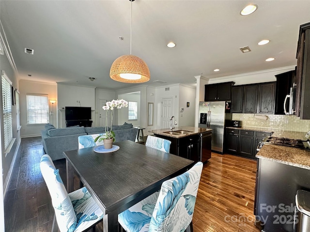 12421 Fiorentina St, Charlotte, NC 28277 - dining area featuring ornamental molding, recessed lighting, wood finished floors, and visible vents