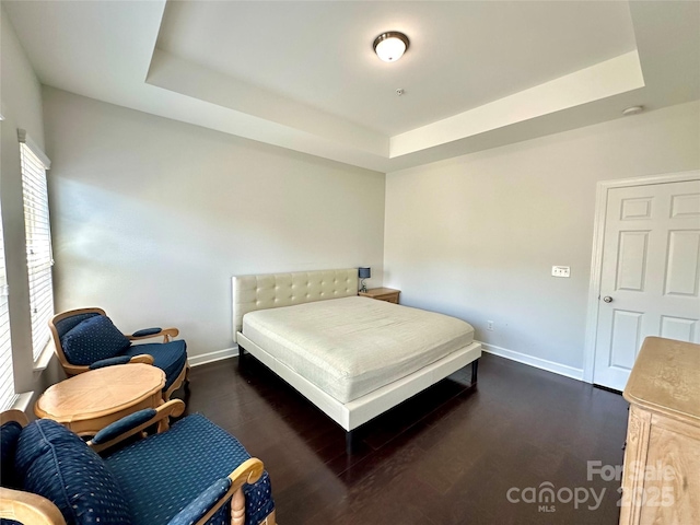12421 Fiorentina St, Charlotte, NC 28277 - bedroom with a tray ceiling, wood finished floors, and baseboards