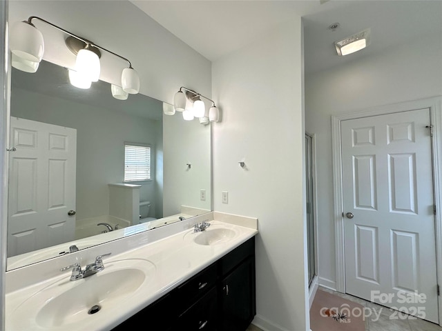 12421 Fiorentina St, Charlotte, NC 28277 - bathroom with toilet, a garden tub, double vanity, and a sink