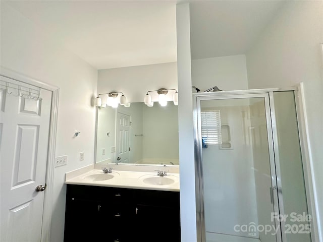 12421 Fiorentina St, Charlotte, NC 28277 - bathroom featuring a shower stall, double vanity, and a sink