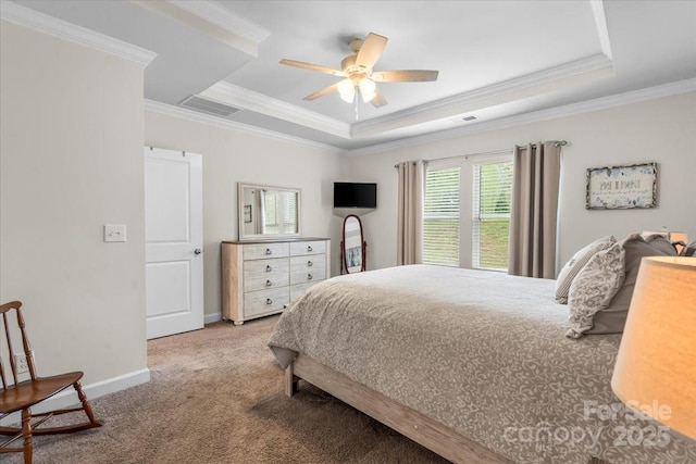 bedroom featuring carpet floors, ornamental molding, visible vents, and a raised ceiling