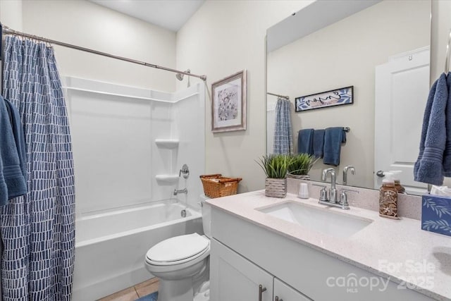 bathroom featuring shower / tub combo, tile patterned floors, vanity, and toilet