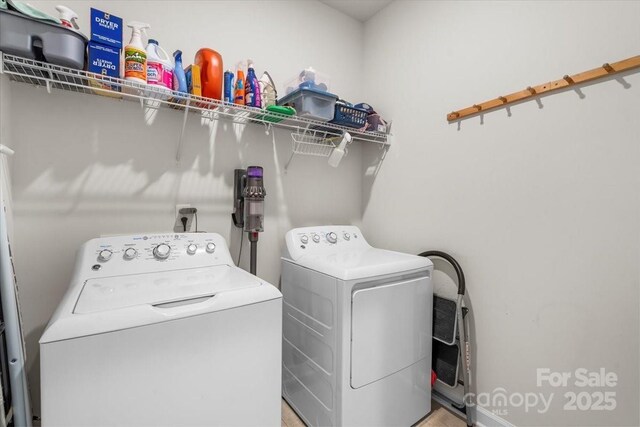 laundry room with washing machine and clothes dryer and laundry area