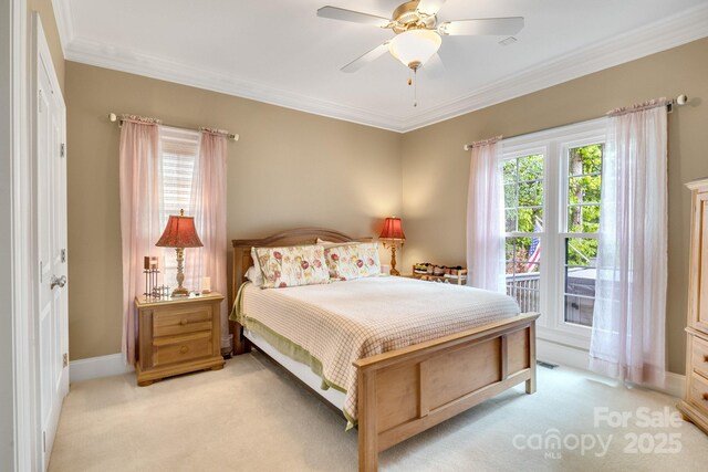 bedroom with crown molding, light colored carpet, and multiple windows