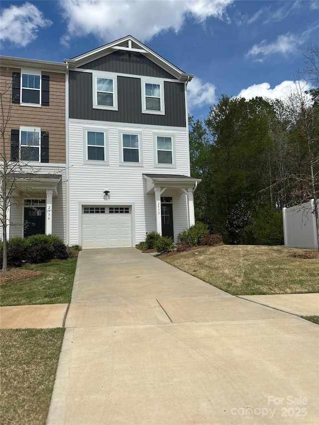 2932 Pirates Pl, Charlotte, NC 28216 - view of front facade featuring driveway, board and batten siding, a garage, and a front yard
