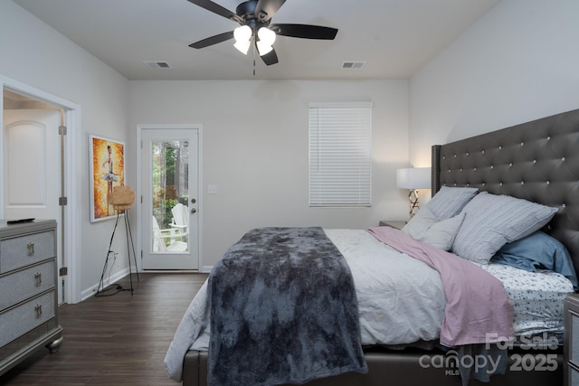 2932 Pirates Pl, Charlotte, NC 28216 - bedroom with dark wood-style flooring, access to exterior, a ceiling fan, and baseboards