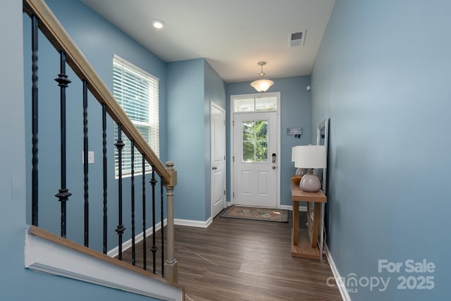 2932 Pirates Pl, Charlotte, NC 28216 - entryway featuring wood finished floors, baseboards, and stairway