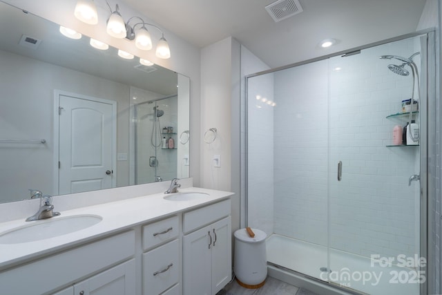 2932 Pirates Pl, Charlotte, NC 28216 - bathroom featuring a stall shower and double vanity