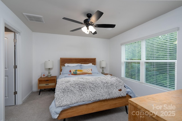 2932 Pirates Pl, Charlotte, NC 28216 - bedroom with light colored carpet, a ceiling fan, and baseboards