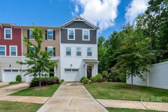 2932 Pirates Pl, Charlotte, NC 28216 - view of property with an attached garage, driveway, and a front lawn