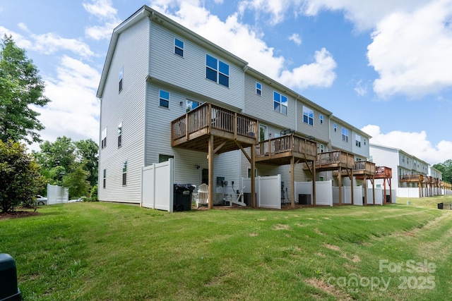 2932 Pirates Pl, Charlotte, NC 28216 - rear view of house with a lawn and a wooden deck