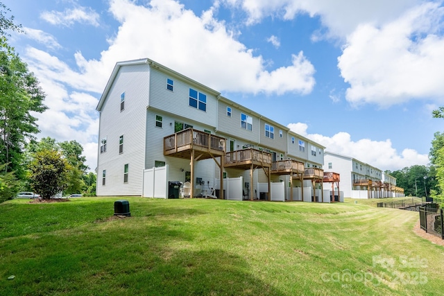 2932 Pirates Pl, Charlotte, NC 28216 - back of property featuring a lawn and a wooden deck