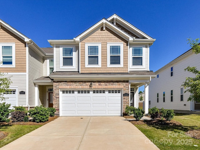 9134 Northfield Crossing Dr, Charlotte, NC 28269 - view of front of home with driveway, stone siding, and a garage