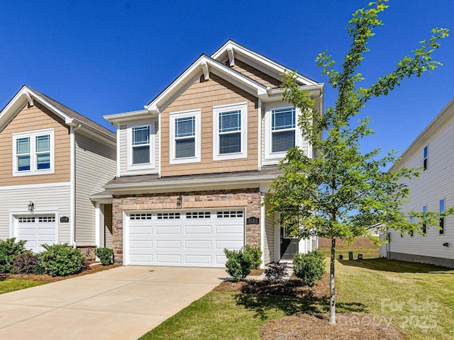 9134 Northfield Crossing Dr, Charlotte, NC 28269 - view of front of home with concrete driveway, a front yard, stone siding, and a garage