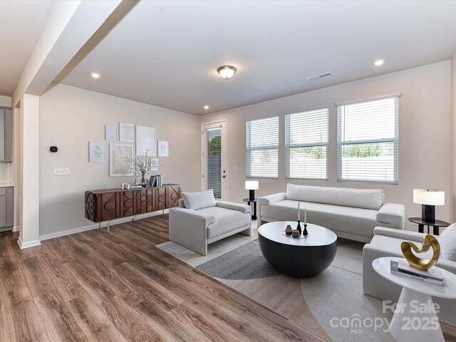 9134 Northfield Crossing Dr, Charlotte, NC 28269 - living area featuring recessed lighting, baseboards, visible vents, and wood finished floors