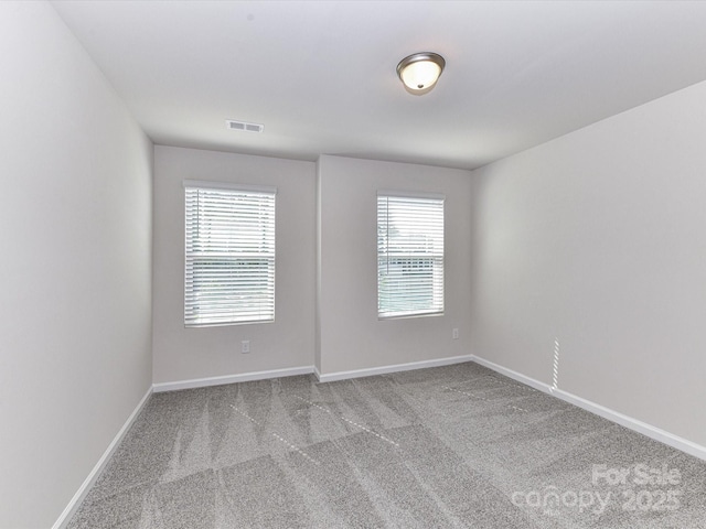 9134 Northfield Crossing Dr, Charlotte, NC 28269 - spare room featuring carpet floors, baseboards, and plenty of natural light