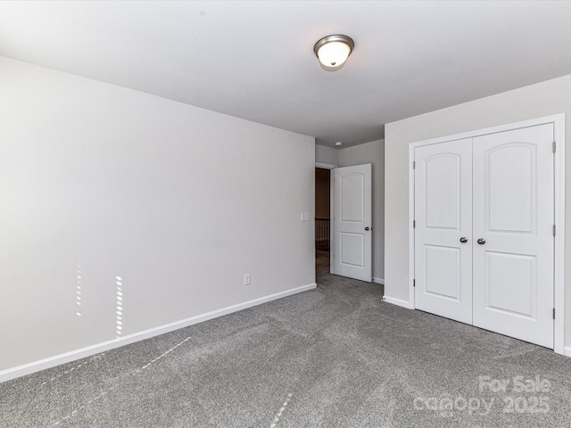 9134 Northfield Crossing Dr, Charlotte, NC 28269 - unfurnished bedroom featuring baseboards, carpet, and a closet