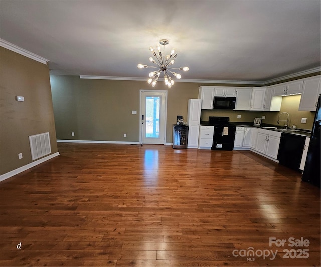 118 Knight Ln, Lawndale, NC 28090 - kitchen featuring an inviting chandelier, ornamental molding, visible vents, black appliances, and dark countertops