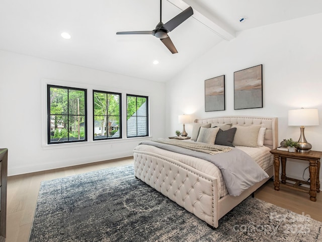 bedroom with wood finished floors, baseboards, vaulted ceiling with beams, and recessed lighting