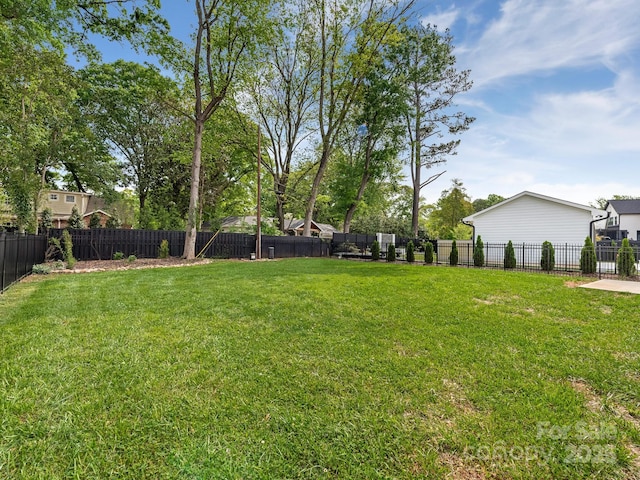 view of yard with a fenced backyard