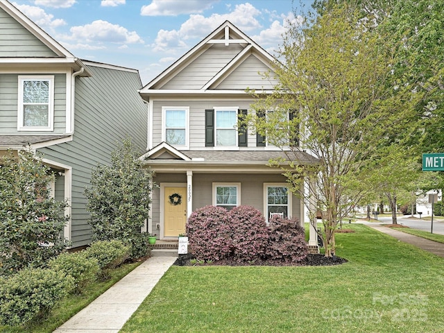 craftsman-style home featuring a front yard