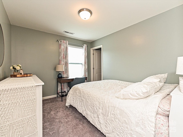 bedroom with carpet, visible vents, and baseboards