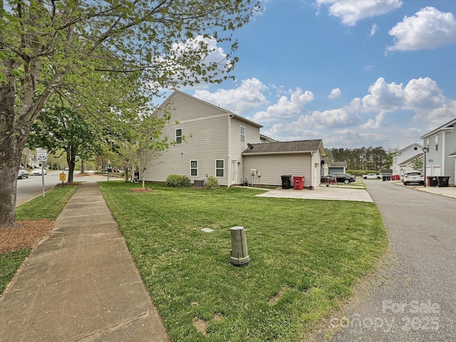 view of property exterior with a lawn
