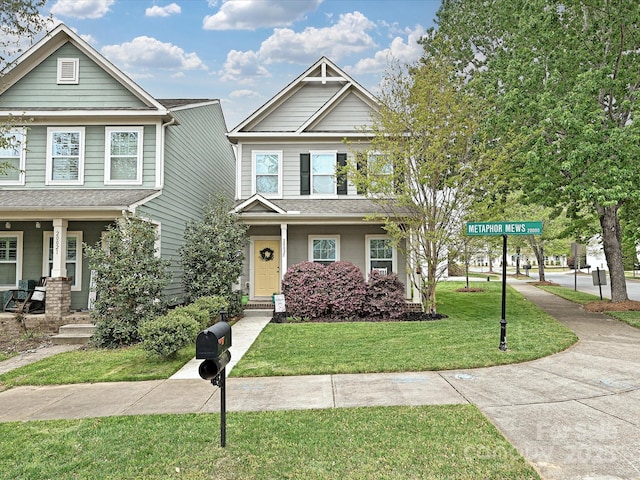 craftsman-style home featuring a front yard