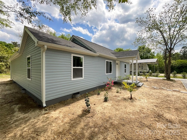exterior space with a shingled roof