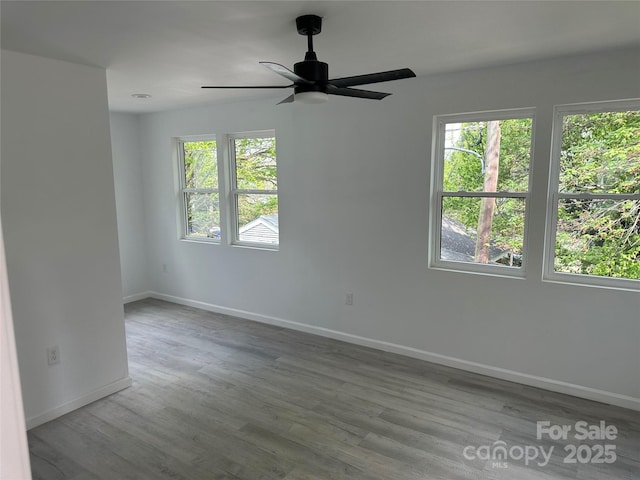 1413 Hateras Ave, Charlotte, NC 28216 - unfurnished room featuring a ceiling fan, wood finished floors, and baseboards