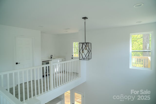 1413 Hateras Ave, Charlotte, NC 28216 - stairs featuring a wealth of natural light and wine cooler