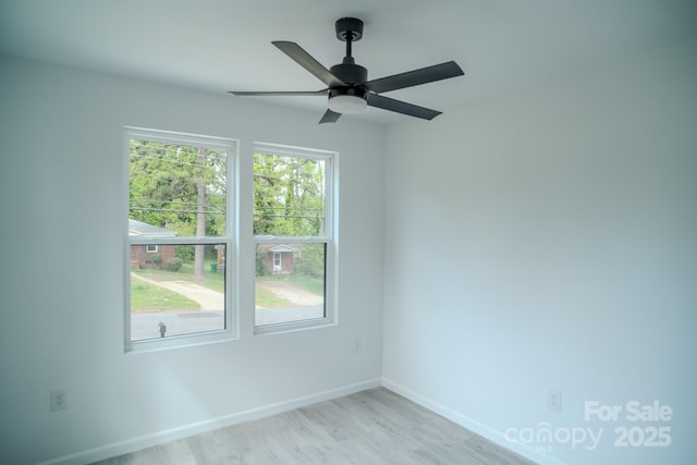 1413 Hateras Ave, Charlotte, NC 28216 - spare room with a ceiling fan, light wood finished floors, and baseboards