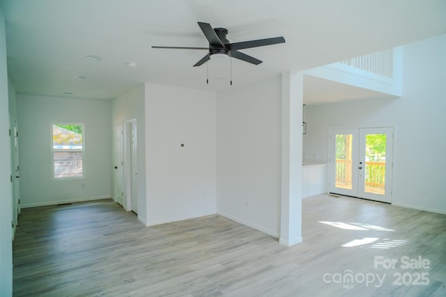 1413 Hateras Ave, Charlotte, NC 28216 - unfurnished room featuring a wealth of natural light, french doors, and light wood-style floors